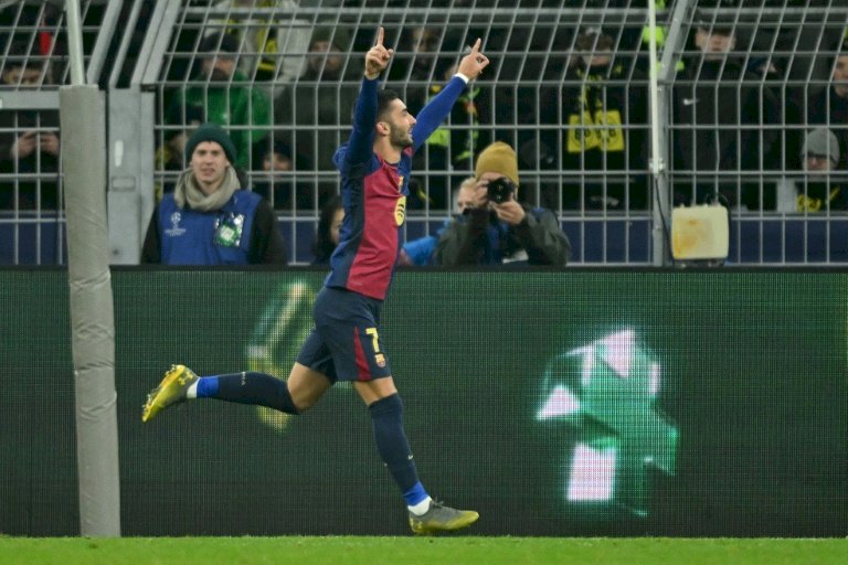 Champions League: Torres double gives Barcelona thrilling win over Dortmund
